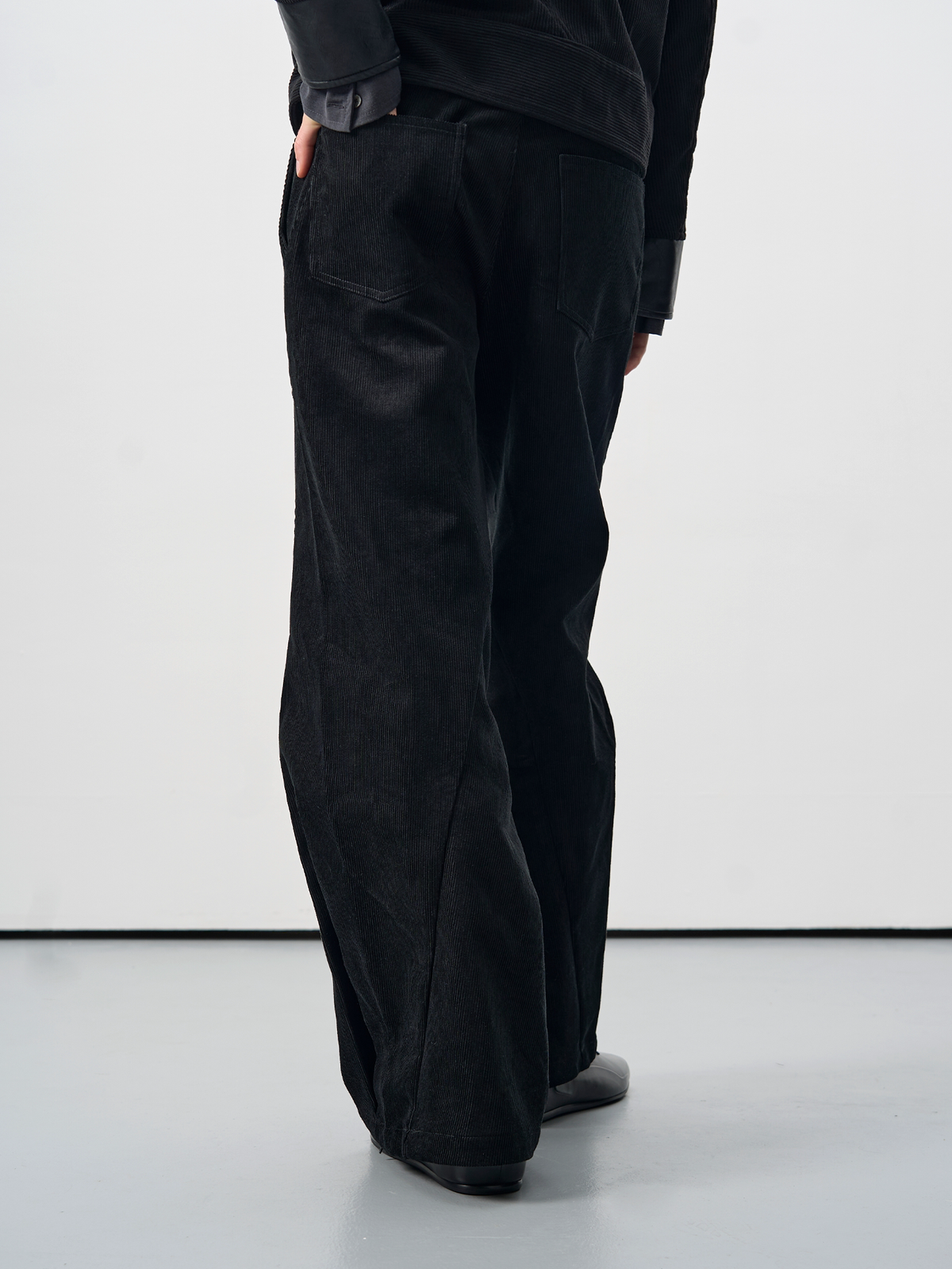 BEVAN UP Entwine Twisted Reverse-Pleat Flared Trousers