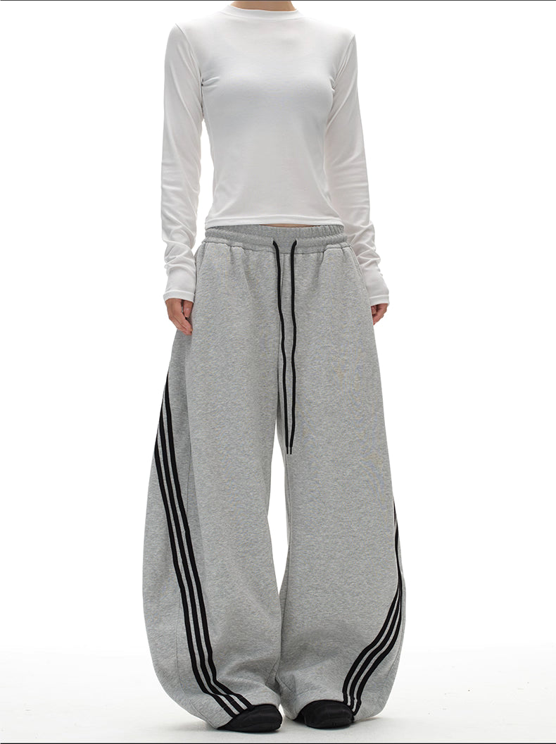 11KN x BTSG three-bar striped draped scimitar sweatpants