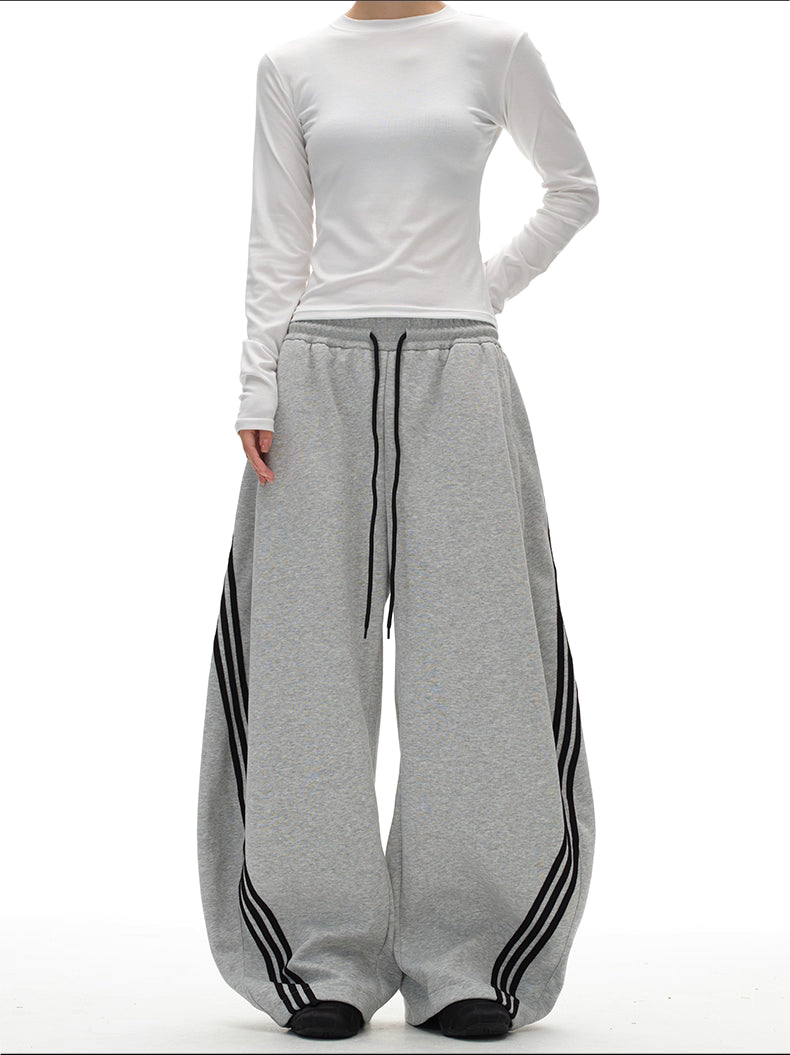 11KN x BTSG three-bar striped draped scimitar sweatpants